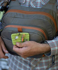 Cross Current Chest Pack For Fly Fishing Gear, Durable 210D Nylon Cyclepond Fabric, with fly box in hand, universal fit.