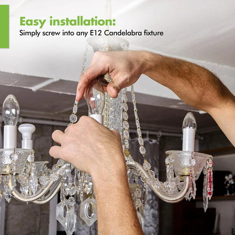 Hands installing 12 Pack LED E12 Candelabra Filament Bulb 60W Equivalent Dimmable in vintage chandelier