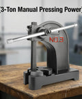 Built Like A Tank 3 Ton Manual Arbor Press With Smooth Pressure Adjustment and 12 Inch Clearance For Benchtop Garage Shop Metal Fabrication Rock Solid Precision Hand Tool on wooden bench.