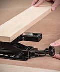 Adjustable Miter Saw Roller Stand With 140 Lb Capacity Height From 2 In To 6.3 In Ball Bearing Rollers For Smooth Free Rolling And Easy Material Loading Hands Free Operation Heavy Duty Support in use, showing wood plank being adjusted with focus on knobs and rollers.