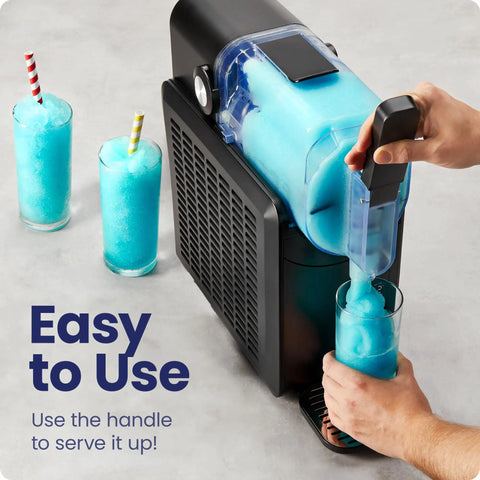 Straight Up Slushie Machine With Zero Ice Required, 48 Oz Frozen Drink Maker pouring slushie into a glass with vibrant blue drink.