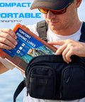 Man holding Pro Grade All In One Bass Fishing Lures Kit With 40 Soft Plastic Baits, 20 Wacky Hooks, portable tackle box