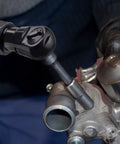 Hella Tough Pneumatic Shop Beast Featuring One Half Inch Five Speed Impact Wrench And Three Eighth Inch Ratchet with a mechanic using the ratchet on an engine part.