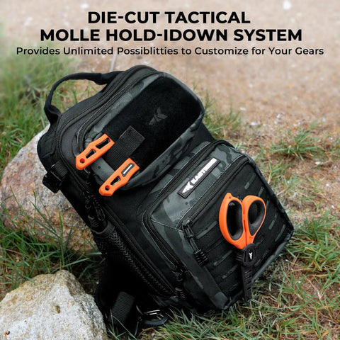 BlowBak Tactical Sling Tackle Bag with MOLLE system and scissors on outdoor ground