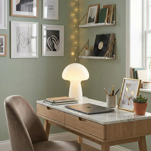 Mushroom Glass Table Lamp 12.75 Inch on a desk with a warm white glow, enhancing cozy ambient lighting for living rooms and bedrooms.