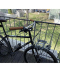 Klunker Upright Bicycle Handlebar for Commuter and Urban Riding, attached to bike with basket on balcony, Nickel Silver Chromoly