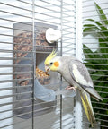 Tough As Nails No Mess Bird Cage Feeder Crack Resistant Seed Catcher for Parrots and Cockatiels with bird eating from feeder.