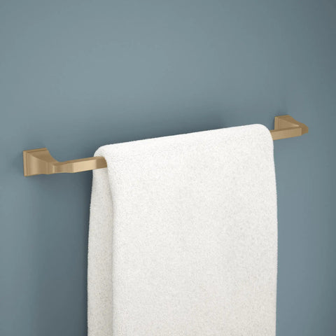 24 Inch Towel Bar Champagne Bronze Finish Space Saving Wall Mounted Bath Accessory with white towel on dark wall