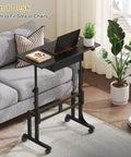 Adjustable Height Sit Stand Desk On Wheels With Drawer beside a gray sofa, showing lockable casters and height settings.