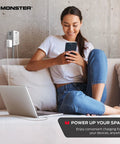 Power Shield XL Surge Protector with Outlet Extender in modern home office, powering laptop and phone from wall plug