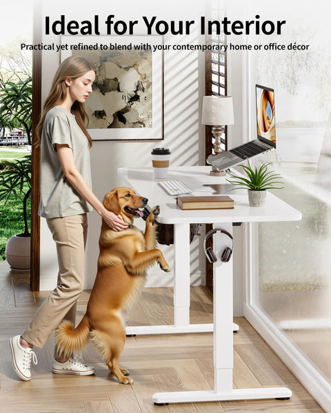 Sleek BIZUM Electric Standing Desk 60 x 24 Inch White with woman and dog, ideal for home office or gaming setup.