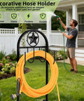 Man using Upgraded Garden Hose Holder With Four Point Stable Base Freestanding Heavy Duty Hose Reel in a lawn setting
