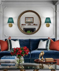 EIDISUNY Battery Operated Wall Sconces beside a round mirror, with rattan shades and gold accents in a living room setting.