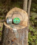 Realtree Camo Duct Tape Roll 1.88 Inch Wide By 10 Yards Beefy Heavy Duty Craft Tape on tree stump in forest setting.