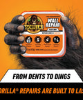 Heavy Duty Wall Repair Spackling Plus Primer 16 Oz White Tub Patch Cracks Holes And Uneven Ceilings With Smooth Finish Easy To Spread No Sag Or Cracking Durable Repair For Walls held by gorilla hand on orange background