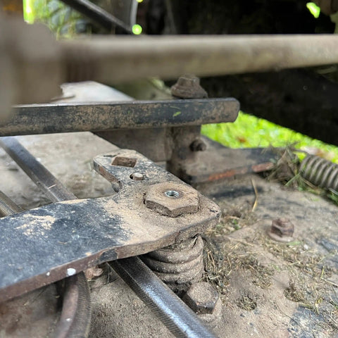 Close-up of mechanical links with installed Metric Grease Fittings Set, 60 Piece Pack For Your Rig, Common Taper Style