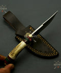 Beefy Stainless Steel Fixed Blade Knife With Wood Bolster Handle And Leather Sheath 8 Inch Overall resting on black surface.