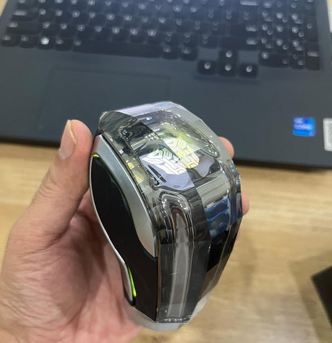 Hand holding Dope Touch Activated LED Crystal Color Changing Automatic Gear Shift Knob With Lock Button on wooden table.