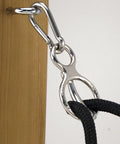 Humane Tie Ring II For Horses With Adjustable Hitch Mount And Mag Loc Feature secured to wooden post