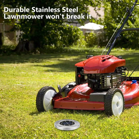 Red lawnmower on grass with 8 Pack Solar Ground Lights With 8 LED Upgraded Outdoor Garden Landscape Lighting nearby