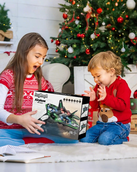 Kids opening Kids RC Plane Drone For Boys And Girls, Remote Control Airplane With LED Lights, 360 Flip Stunts, Green box
