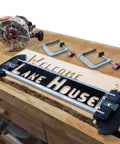 Sign Making Router Kit With 2.5 Inch And 1.5 Inch Horizontal Letters And 1.5 Inch And 2.5 Inch Vertical Numbers on wooden table
