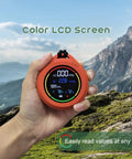 Hand holding 5 In 1 Rechargeable Oxygen Monitor With CO And O2 Readouts, showing color LCD screen readouts for camping.