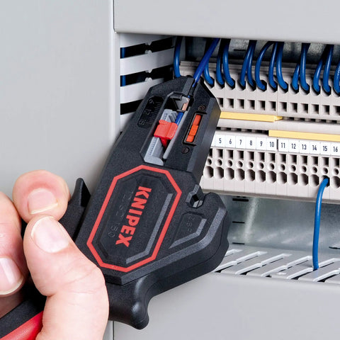 Self Adjusting Insulation Strippers For 10 AWG To 24 AWG Wires With Automatic Stripping And Built In Wire Cutter For Copper And Aluminum Up To 14 AWG, Adjustable Length Stop For Repeatable Strips, Pro Grade Cable Tool in use near a wiring panel