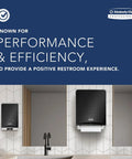 Restroom with black touchless towel dispensers above sinks for efficient hand drying