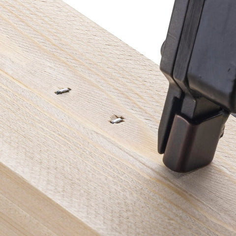Built Tough No Fuss Heavy Duty Galvanized Narrow Crown Staples 18 Gauge One Quarter Inch Chisel Tip being used on wood.