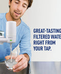 Man using On Tap Filtration System Replacement Filter White For Faucet, Easy Install Water Filter Cartridge in kitchen sink