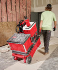 Worker pulling cart with Packout 36oz Insulated Bottle With Chug Lid All Day Thermal Retention Double Wall Vacuum Insulation.