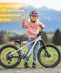 Child with bicycle featuring Colorful 315 Piece Bike Wheel Spoke Beads Kit With Star Heart And Sphere Shapes Clip On Decorations