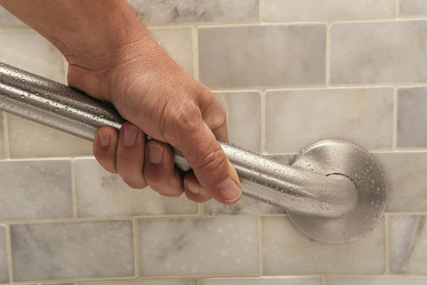 Person gripping Heavy Duty 18 Inch Bathroom Grab Bar With Concealed Screw Mounting And Mirror Polish Stainless Steel Finish