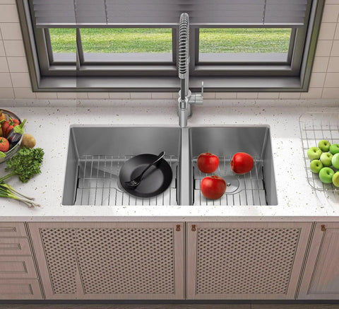 Badass Heavy Duty 304 Stainless Steel Sink Protector Grid with apples and a plate in a double sink, 16.15 x 12.4 size.