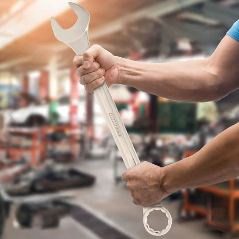35mm Jumbo Combination Wrench Chrome Plated With Raised Panel Design held in hand, showing open and box ends in an industrial setting