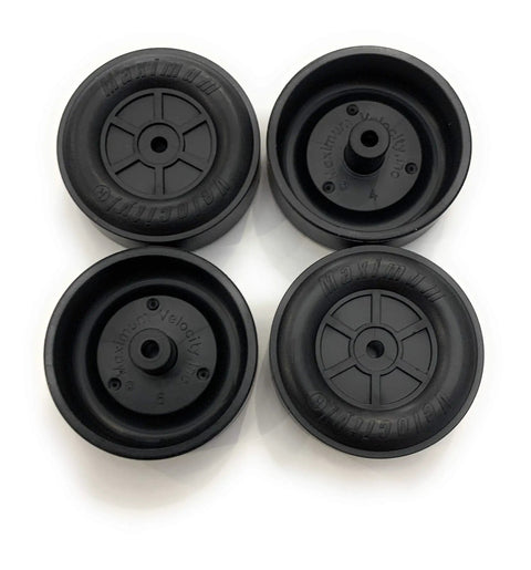 Close-up of black wheels from Bulk Pinewood Derby Car Kits Pack Of 12 With Wheels And Axles, Burr Free Axles For Speedy Races