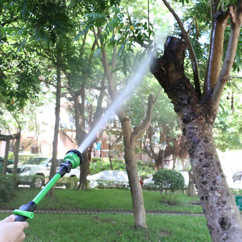 Lightweight 18 Inch Watering Wand With 9 Pattern Spray, Pivoting Head And Thumb Control in use watering a tree.