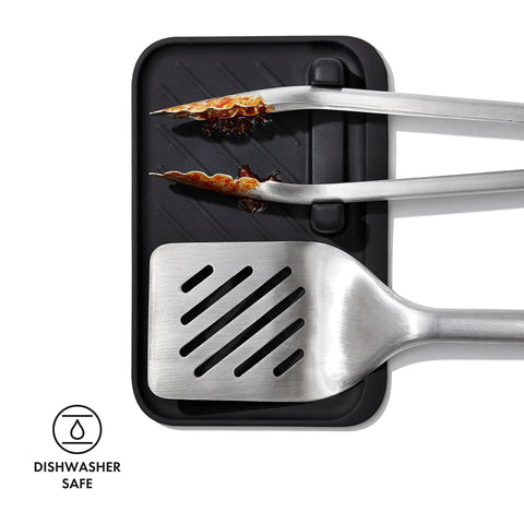 Three Piece Grilling Tool Set With Stainless Steel Turner Scalloped Tongs And Silicone Tool Rest Built In Bottle Opener Non Slip Grip And Tong Holder Designed For One Handed Use With Extra Leverage From A Double Bend