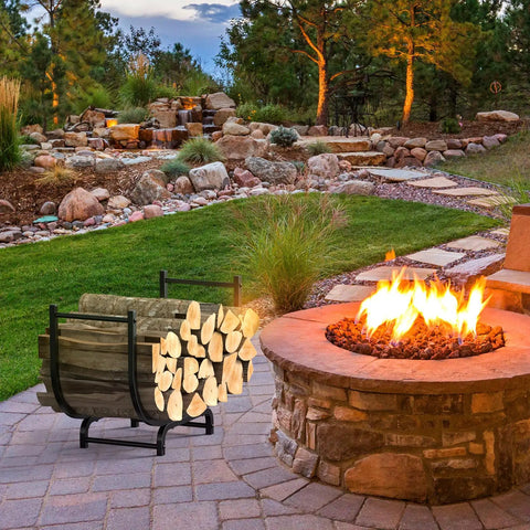 Curved 32-Inch Firewood Rack, Powder-Coated Rustproof Metal Log Holder for Fireplaces and Outdoor Use next to a lit fire pit in a garden setting.