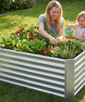 Mother and child gardening in 2 Pack Raised Garden Bed 4x2x2 Ft Galvanized Steel With Deep Root Planter Boxes Wing Nut Fasteners And Safety Edges