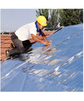 Tough As Nails Self Adhesive Roofing Underlayment Roll applied on a roof by a worker, showcasing durability and effectiveness.