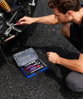 Man using 34 Piece One Fourth Inch Drive Mini Socket Ratchet Set With Bits Magnetic Driver Dual Socket And Bit Head Ratchet