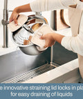 Person draining water using Six-Quart Stainless Steel Multipot With Built-In Straining Lid For No Fuss Cooking Induction Ready And Oven Safe