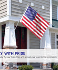 Fly Breeze 3x5 Foot American National Flag With Fade Proof Colors, Canvas Header And Double Stitched Edges displayed outside a house.