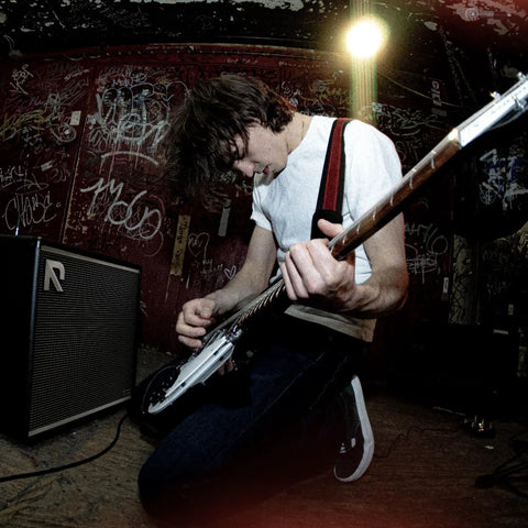 Musician playing with 50 Watt Intelligent Guitar Combo Amp With Amp Intelligence, Prompt Photo And Audio Tone Creation, USB Recording.