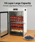 Heavy Duty Electric Food Dehydrator With 18 Spacious Stainless Steel Trays and Precision Adjustable Thermostat filled with fruits.