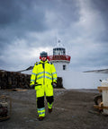 Worker wearing Hi Vis Winter Work Jacket With Reflective Waterproof Shell And Thermal Quilted Lining ANSI 3 Safety Coat X Large