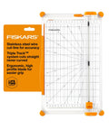 Precision Paper Trimmer With SureCut Wire Cut Line And TripleTrack System, ergonomic design, shown with packaging