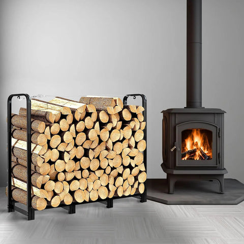 4Ft Firewood Rack Stand Built Tough Heavy Duty Wood Storage Stack Holder next to indoor stove, loaded with firewood logs.